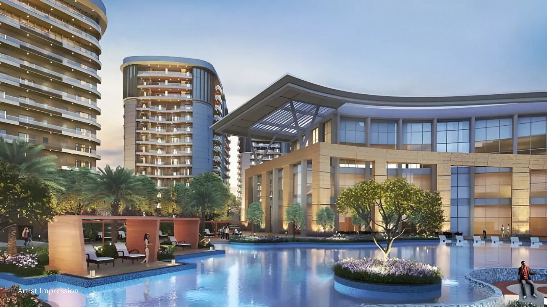 Luxurious clubhouse and swimming pool at Rishita Serenity at dusk.