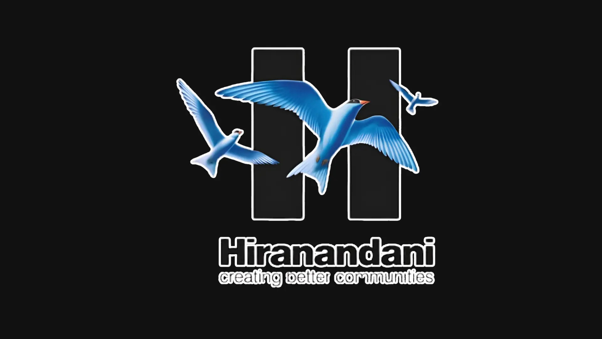 Hiranandani logo featuring three flying blue birds over a stylized H symbol and tagline creating better communities.