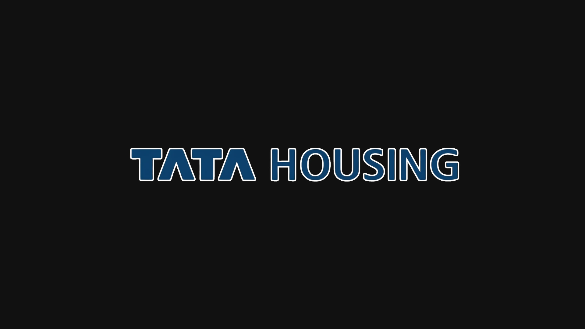 Tata Housing logo featuring the characteristic blue "TATA" font followed by white "HOUSING" text on a black background.